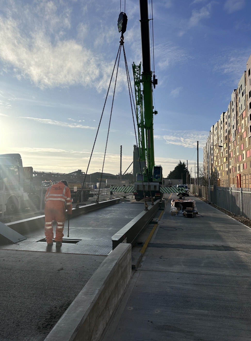 Sennebogen crane installing a weighbridge platform